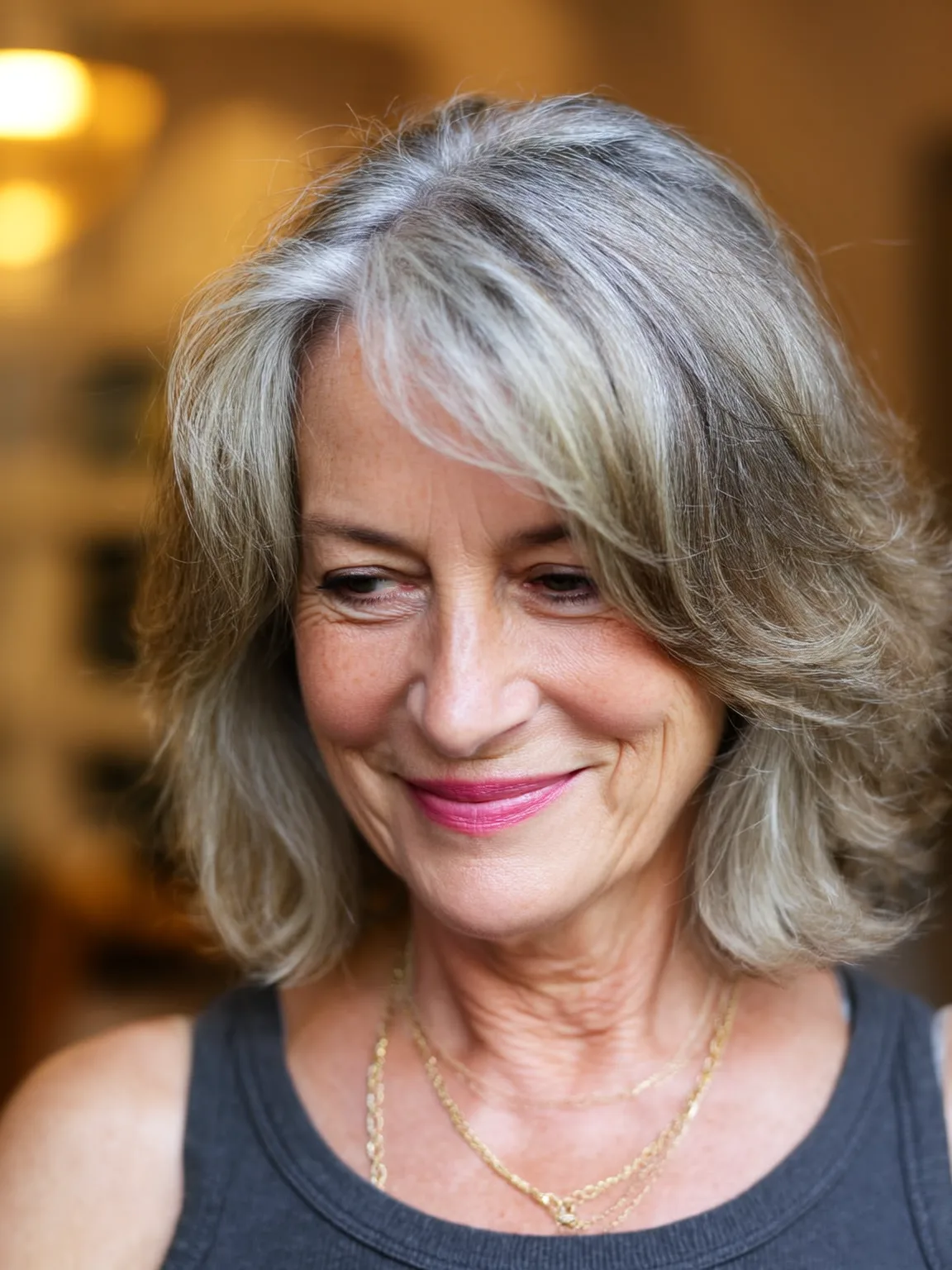 Layered Wavy Bob with Natural Lowlights and Side-Swept Bangs